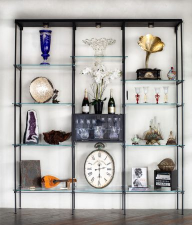 The Aspen Series Wolf Aspen Series floor-mounted metal and glass shelving displaying art and collected objects